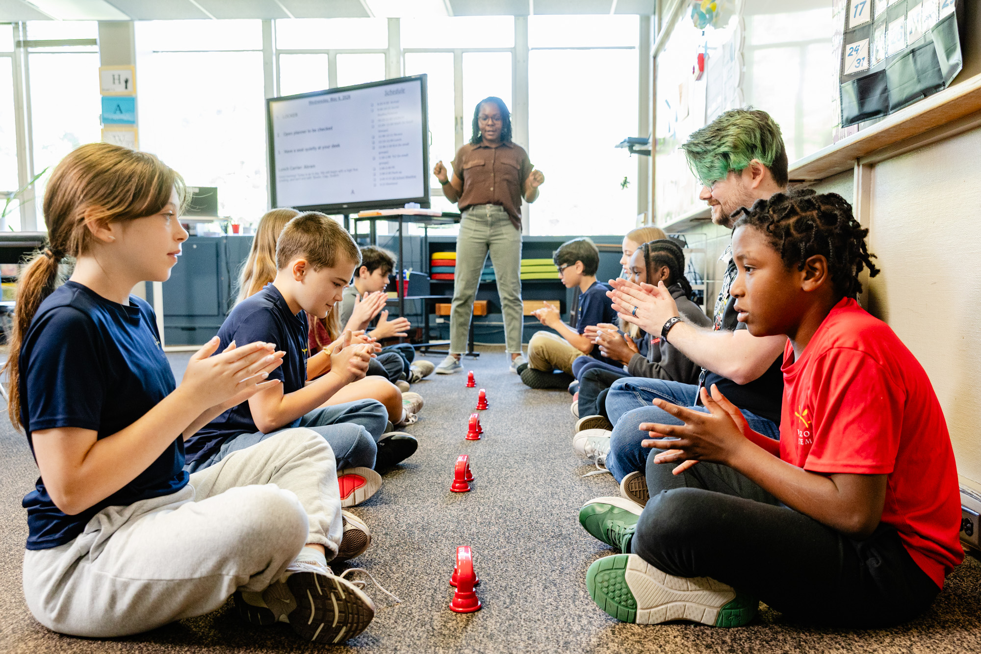 Intermediate school students participating in a collaborative hands-on classroom activity.