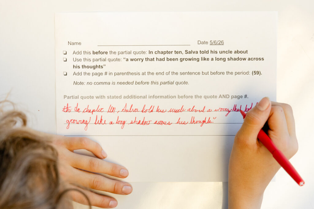 Close-up of a student's written classroom assignment demonstrating academic progress.