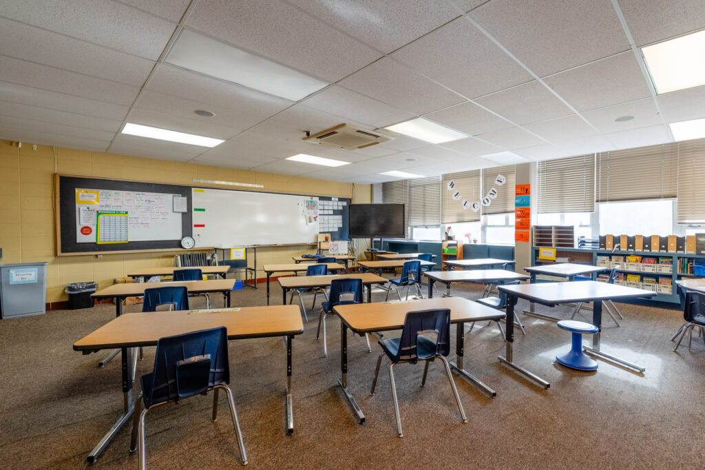 Classroom with student desks, chairs, and learning materials at Horizon Academy.