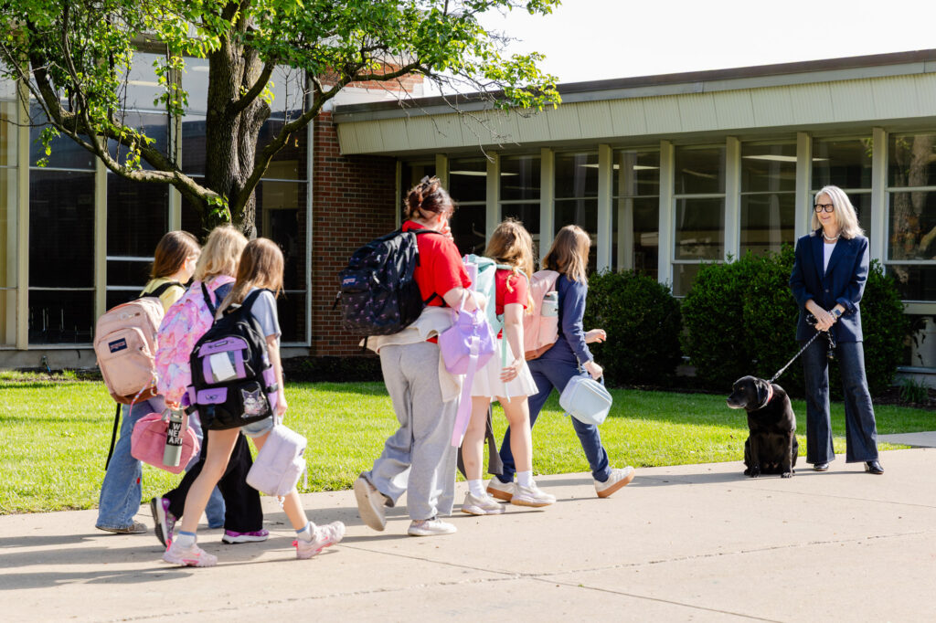 Students and staff gathering outdoors for a morning meeting at Horizon Academy.