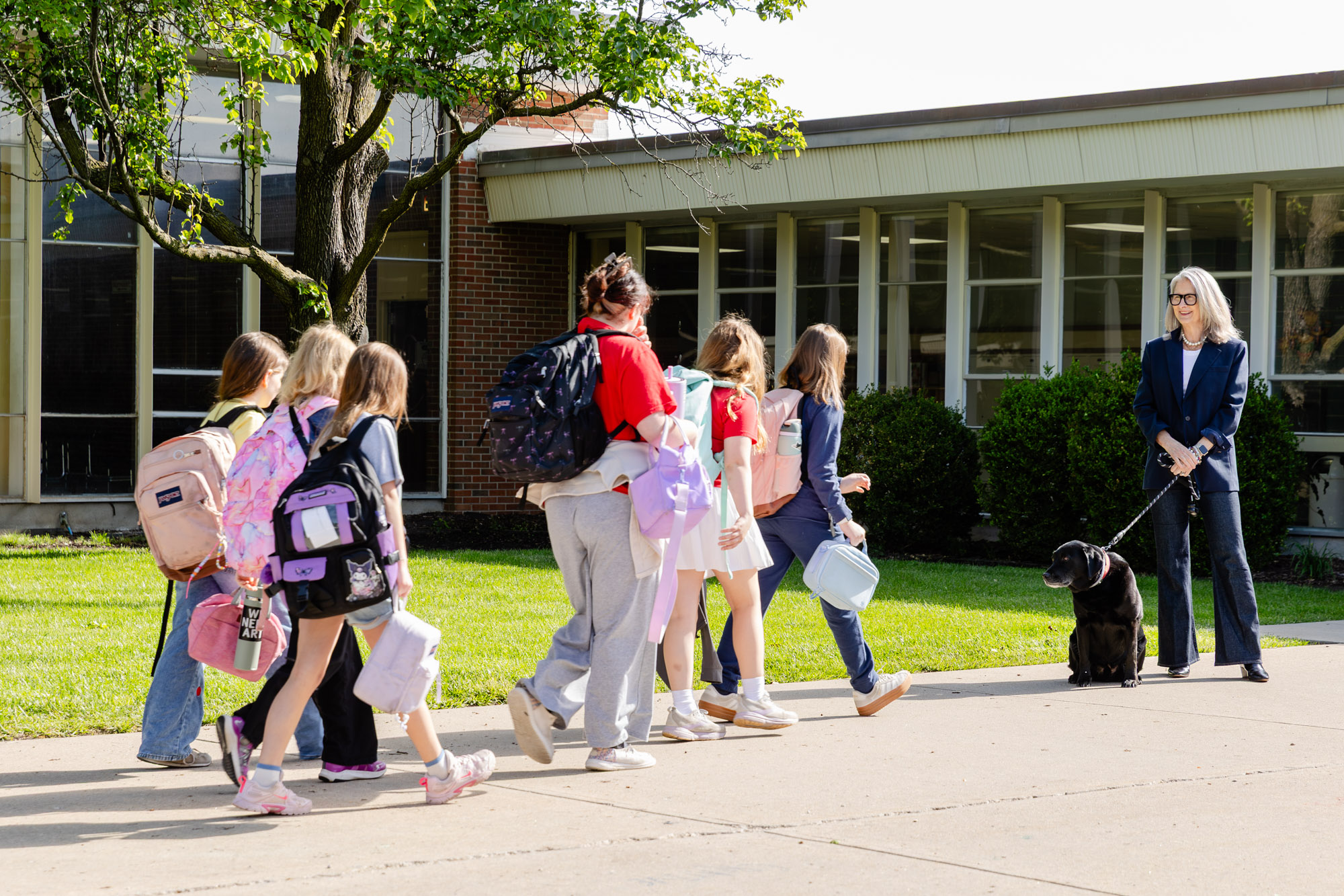 Students and staff gathering outdoors for a morning meeting at Horizon Academy.