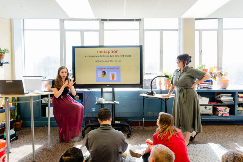 Middle school students participating in an interactive classroom lesson.