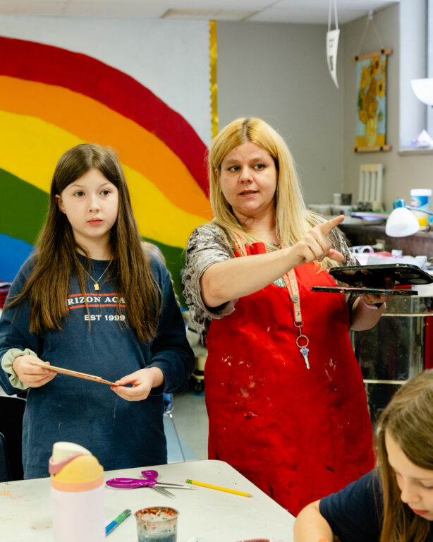 Staff member leading students during a classroom activity at Horizon Academy.