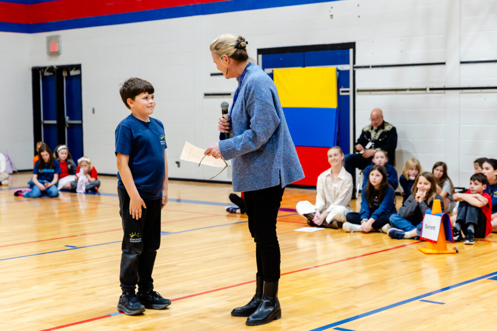 Student interacting with a staff member during a Horizon Academy student program.