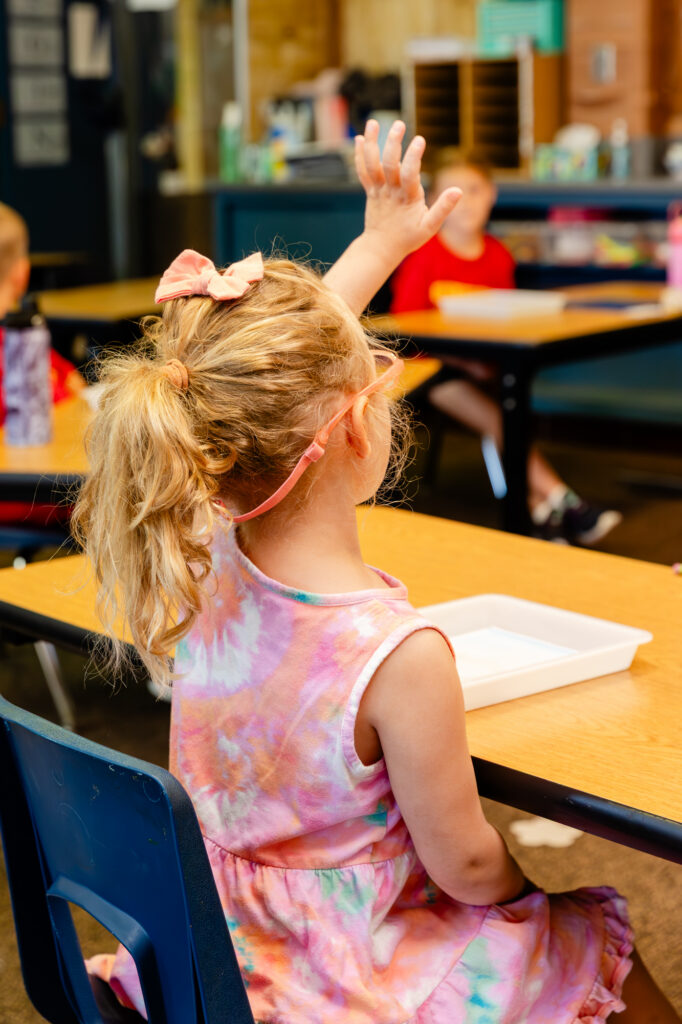 Student working independently at a classroom desk during a Horizon Academy summer program.