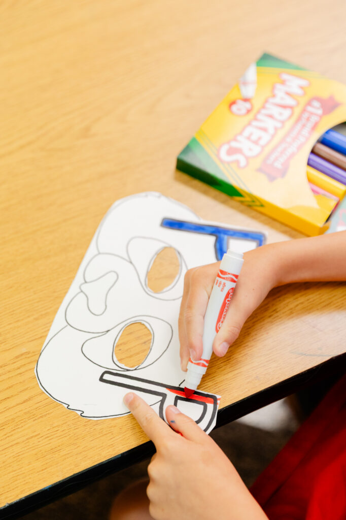 Hands-on educational activity using picture cards during a Horizon Academy summer program.