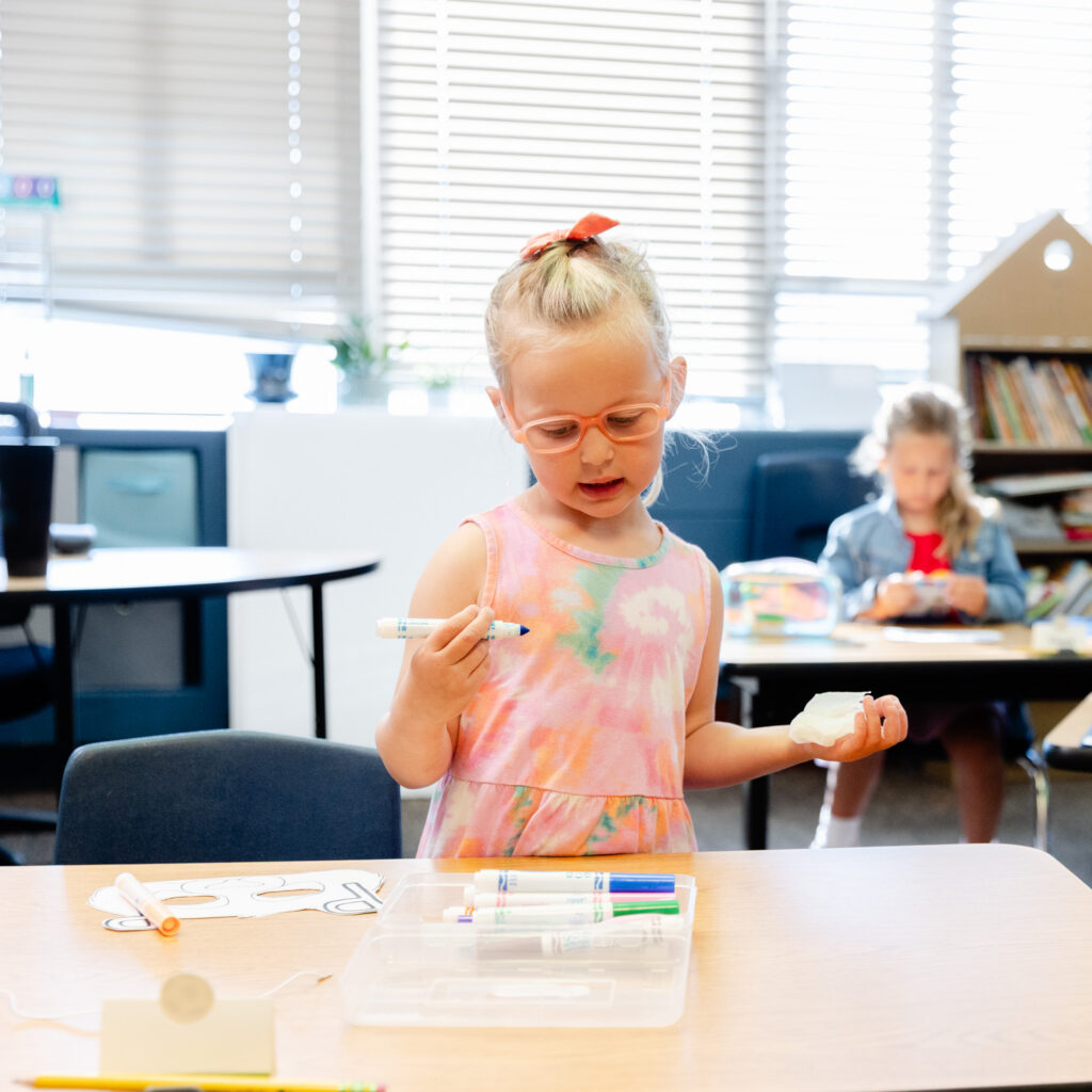 Student participating in a hands-on classroom activity during a Horizon Academy summer program.