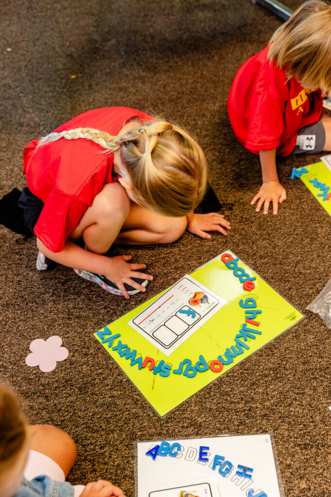 Student participating in a hands-on summer program learning activity.