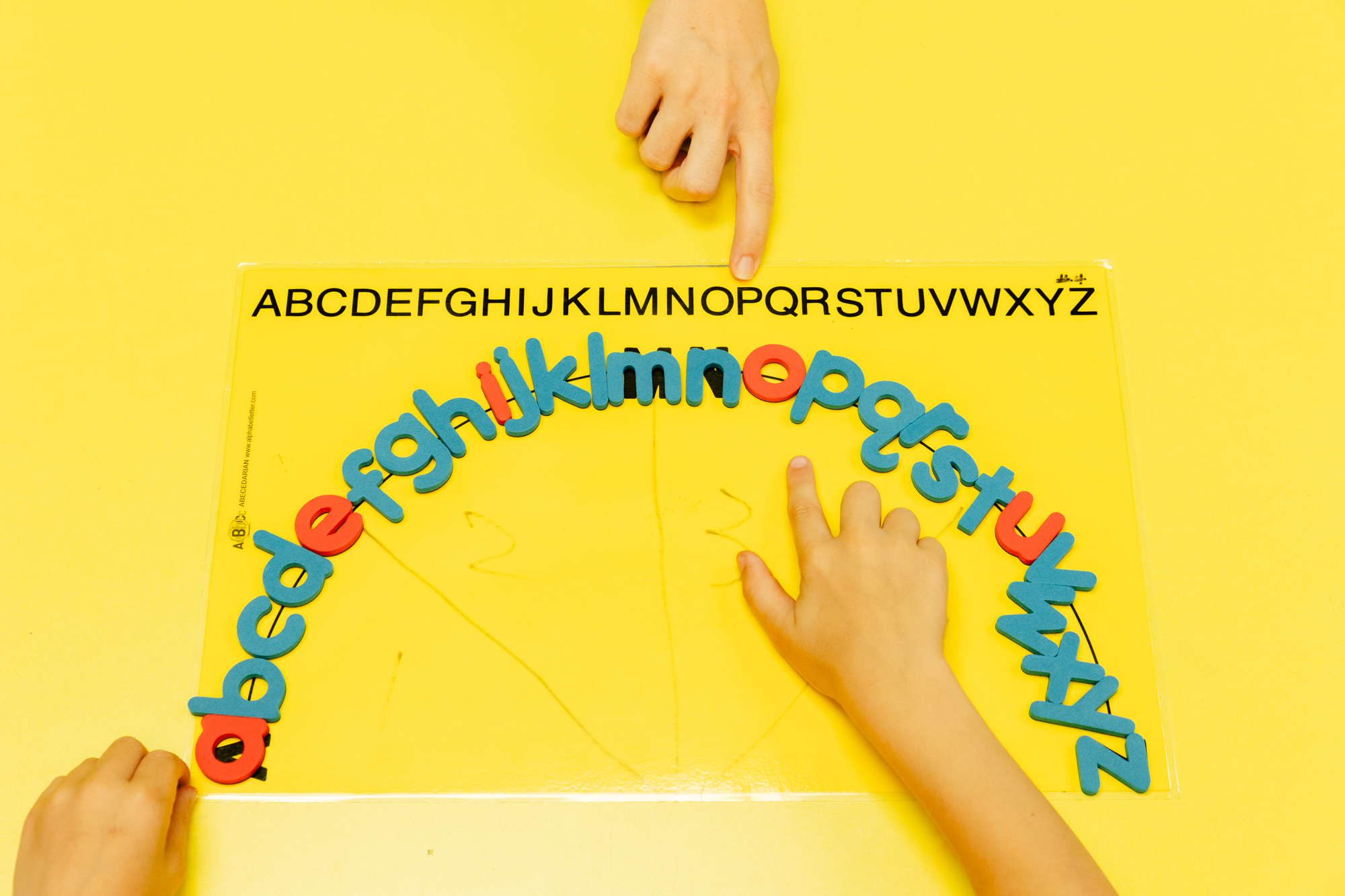 Alphabet letters arranged in a circle during a hands-on literacy activity.