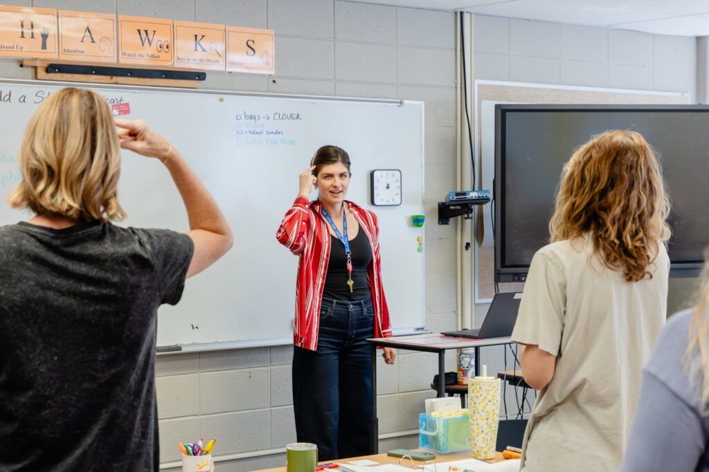 Instructor leading a discussion during a teacher training session.