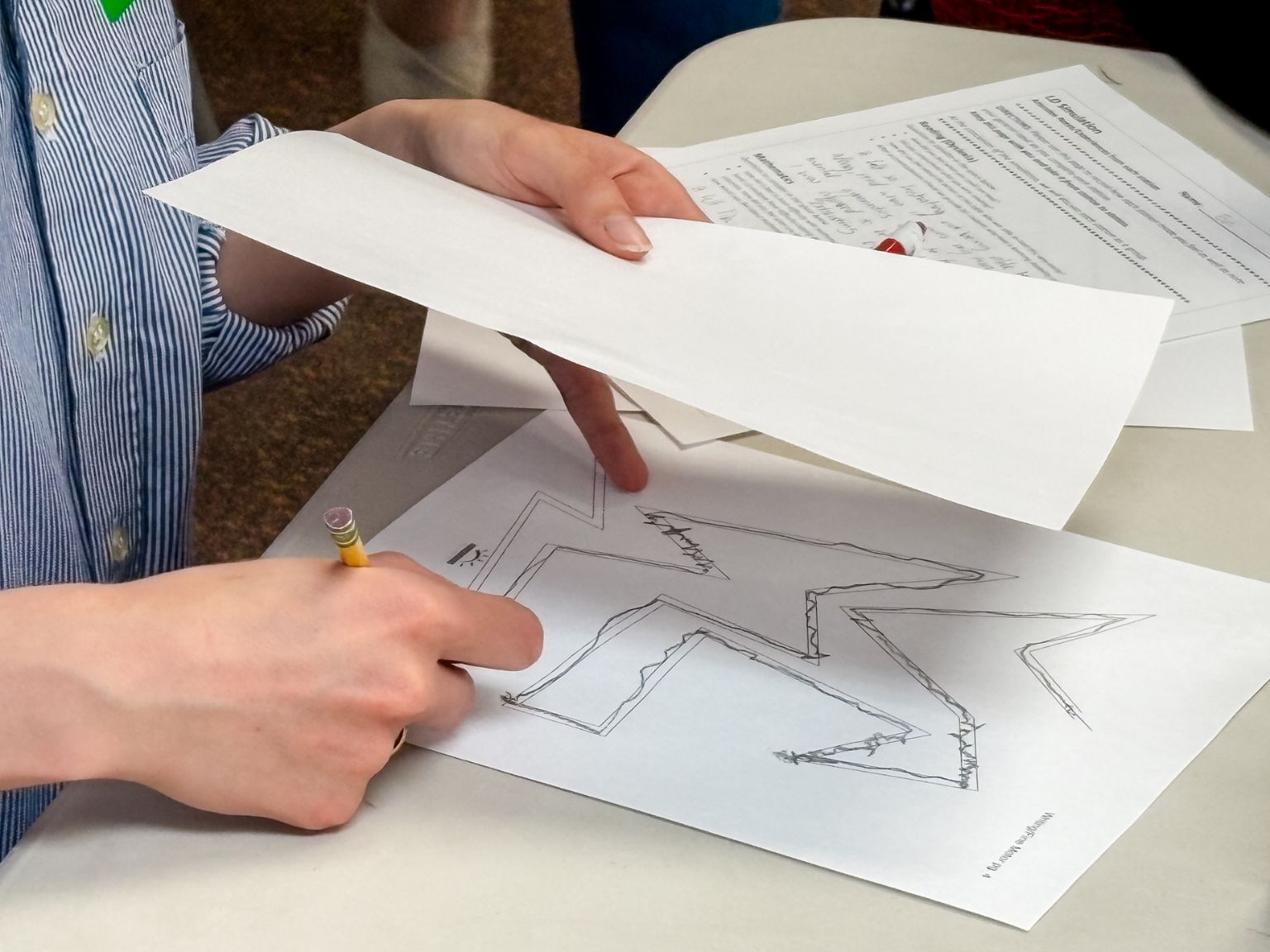 Hands-on learning disability simulation activity using specialized instructional materials.