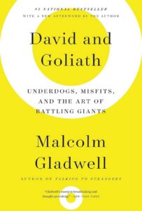Book cover for Malcolm Gladwell’s *David and Goliath*, with black serif lettering on a bright yellow-and-white circular design; bold, thoughtful, and energetic.